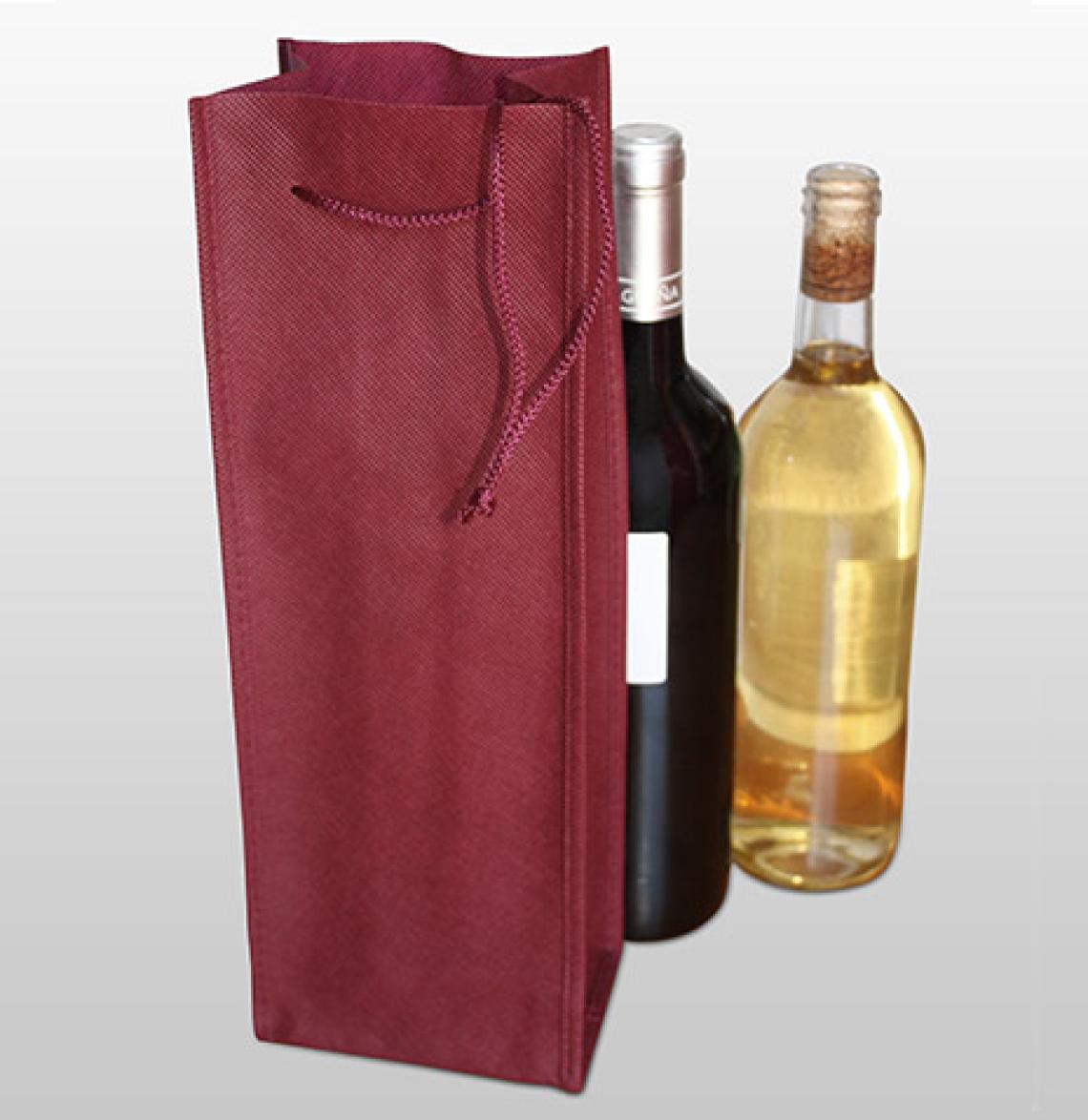 Bolsas de tela a medida junto a una botella