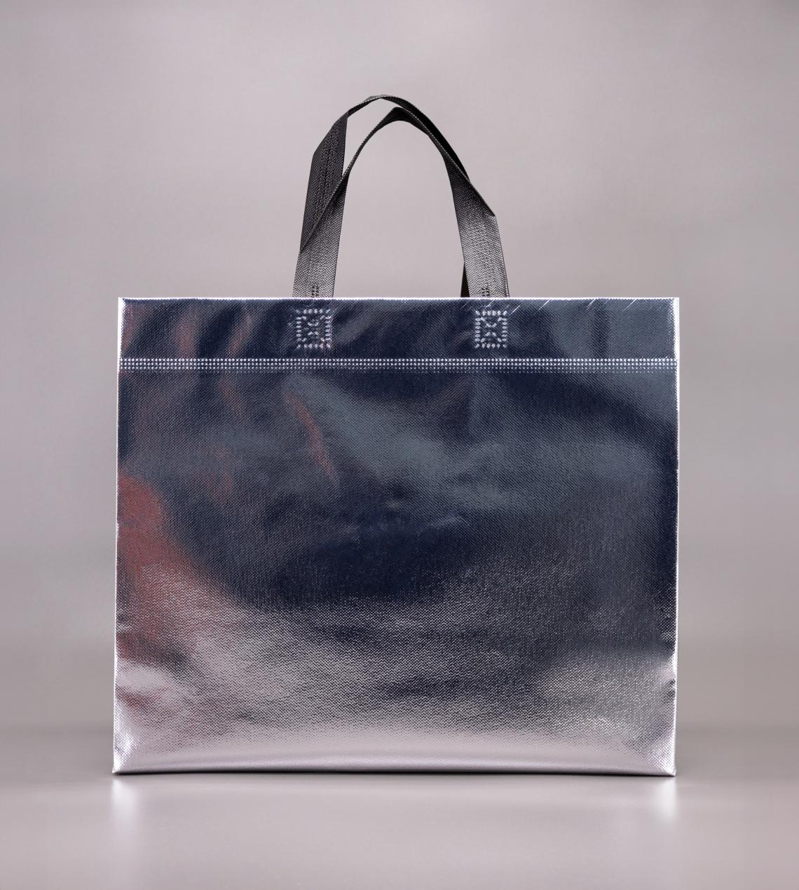 Bolsas de tela con asas cortas de color plata grandes